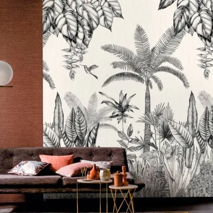 Mural de papel pintado con una selva en blanco y negro detrás del sofá
